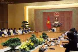 Standing Deputy Prime Minister Pham Gia Tuc chairs a meeting with representatives of US business associations and companies operating in Vietnam on July 17, 2026. (Photo: baochinhphu.vn)