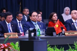 Prime Minister Pham Minh Chinh (C) attends the 22nd ASEAN-India Summit (Photo: VNA)