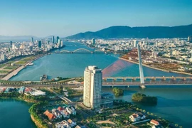 An aerial view of the Han River in Da Nang city, a tourist magnet of Vietnam. The total number of foreign visitors to Vietnam during January-August reaches nearly 14 million (Photo: VNA)