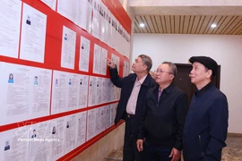 Hanoi voters learn about candidates’ biographies and action programmes. (Photo: VNA)