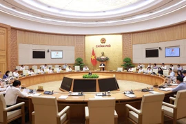 Prime Minister Pham Minh Chinh chairs the monthly Government law-making session on July 23. (Photo: VNA)