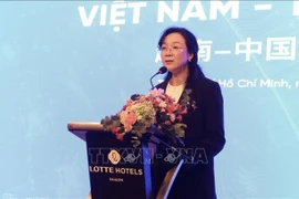 Yang Yanyan, Chairwoman of the Guangxi Council for the Promotion of International Trade, speaks at the Vietnam–China Business Seminar (Photo: VNA)