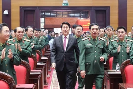 State President Luong Cuong (in black suite) attends the national political-military conference in Hanoi on December 17. (Photo: VNA)