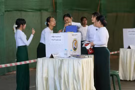 Officials of the Union Election Commission (UEC) count printed records of votes during the third phase of the general election at a polling station in Yangon, Myanmar, Jan. 25, 2026. (Photo: xinhua)
