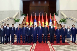 Party General Secretary To Lam (7th from right) and Party General Secretary and President of Laos Thongloun Sisoulith (6th from right) co-chair the High-Level Meeting between the Communist Party of Vietnam and the Lao People’s Revolutionary Party on December 2, 2025. (Photo: VNA) 