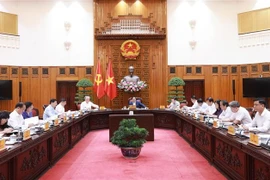 Prime Minister Pham Minh Chinh chairs the meeting of the Government’s Steering Committee for reviewing Resolution No. 18-NQ/TW on the restructuring of public service units under ministries, sectors, and localities on October 6. (Photo: VNA)