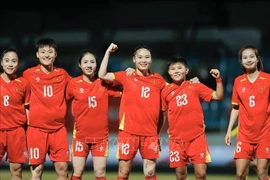 The joy of Vietnamese players as Hai Yen (third from right) scores the opening goal in the 4th minute of the match. (Photo: VNA)