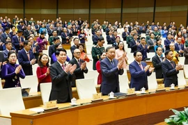 Party General Secretary To Lam (second from left), other high-ranking Party and State leaders, and NA deputies attend the closing session of the 15th NA's 10th session (Photo: VNA)