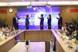 Delegates launch the portal for science, technology products, solutions on April 9. (Photo: mic.gov.vn)