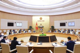 An overview of the monthly Government meeting on law-making (Photo: VNA)