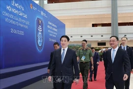 State President Luong Cuong (L) inspects preparations for the signing ceremony of the United Nations Convention against Cybercrime at the National Convention Centre in Hanoi. (Photo: VNA)