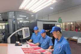 Workers at Printing No. 7 Joint Stock Company resume production on the first working day of the Lunar New Year 2026. (Photo: VNA) 