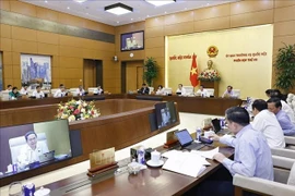 The NA Standing Committee gives opinions on the draft amended Law on Public Employees. (Photo: VNA)