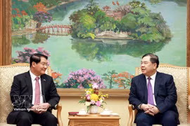 Standing Deputy Prime Minister Pham Gia Tuc (R) receives Athsaphangthong Siphandone, member of the Lao People’s Revolutionary Party Central Committee, Secretary of the Vientiane Party Committee and Chairman of the municipal People’s Council, on May 12, 2026. (Photo: VNA)