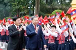 General Secretary of the Communist Party of Vietnam Central Committee To Lam (L) and General Secretary of the Lao People’s Revolutionary Party (LPRP) Central Committee and President of Laos Thongloun Sisoulith review the guard of honour (Photo: VNA)