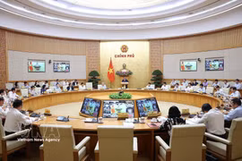 The Government’s regular meeting for March and the Government-to-locality teleconference on April 4 (Photo: VNA)