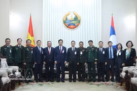 Defence officials of Vietnam and Laos at the meeting in Vientiane on October 8, 2026 (Photo: VNA) 