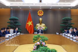 Prime Minister Le Minh Hung holds phone talks with his Canadian counterpart Mark Carney on July 21. (Photo: VNA)