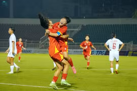 Vietnamese players celebrate a goal at the match against Myanmar on June 9 (Photo: VNA)