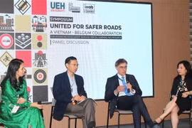 Some participants in the symposium held at the University of Economics Ho Chi Minh City on April 3 (Photo: VNA)