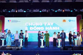 Participants mark the launch of the national drive to protect and support children in cyberspace for the 2026–2030 period on May 29. (Photo: VNA)