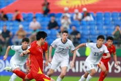 Captain Khuat Van Khang scores the opening goal for Vietnam. (Photo: Published by VNA) 
