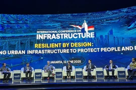 At the panel discussion (Photo: VNA)