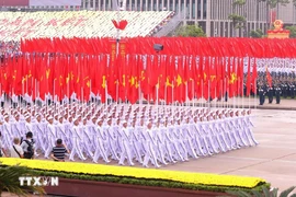 The formation featuring the Party flag and the national flag at the parade marking the 80th anniversary of the August Revolution and National Day on September 2, 2025 (Photo: VNA)