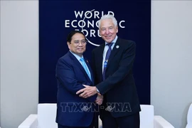 Prime Minister Pham Minh Chinh meets with WEF Interim Chairman Peter Brabeck-Letmathe. (Photo: VNA)