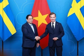Vietnamese Prime Minister Pham Minh Chinh (L) and his Swedish counterpart Ulf Kristersson. (Photo: VNA)