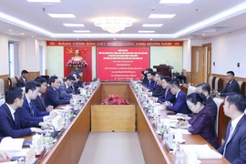 At the working session (Photo: VNA)