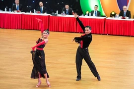 Phan Hien – Thu Huong dance pair at a competition (Photo: Hanoi Moi)