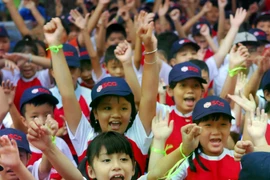 Vietnamese students from preschool to high school enjoy tuition-free education (Photo: VNA)