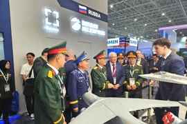 The Vietnamese delegation visits Russia' booth (Photo: VNA)