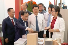 Visitors at the exhibition (Photo: VNA)