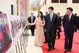 President Luong Cuong and Lao Party General Secretary and President Thongloun Sisoulith attend the exhibition (Photo: VNA)
