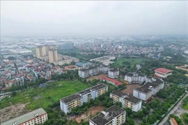 The Ministry of Construction plans to ease permit procedures for projects with approved 1/500 detailed planning, aiming to cut red tape and speed up approvals. (Photo: VNA)