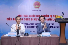 Deputy Minister of Home Affairs Cao Huy (L) and ILO's representative Felix Weidencaff co-chair the workshop (Photo: VNA)