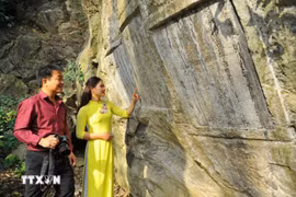 The Han-Nom inscriptions, carved directly into the cliffs of the Special National Historic and Scenic Site of Non Nuoc Mountain (Photo: VNA)