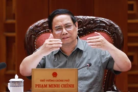 Prime Minister Pham Minh Chinh speaks at the meeting (Photo: VNA)