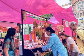 Visitors view accessories for ao dai (Vietnamese traditional dress) at an art programme at the HCM City Book Street in District 1 (Photo courtesy of Book Street Company)