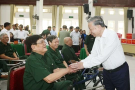 Party General Secretary To Lam visits wounded soldiers at the Thuan Thanh Nursing Centre for War Invalids in Ninh Xa ward, Bac Ninh province, on July 15, 2025. (Photo: VNA)