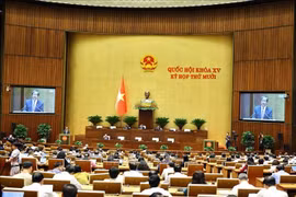 Deputies on October 22 morning listen to proposals and verification reports on three draft laws concerning the education sector. (Photo: VNA)