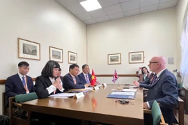 Finance Minister Nguyen Van Thang holds a meeting with the UK Prime Minister’s Trade Envoy Matt Western. (Photo: VNA)