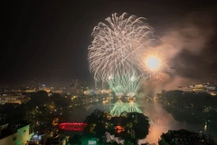 Colourful fireworks light up the area around Hoan Kiem Lake to welcome the 2026 New Year.