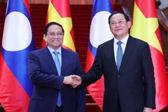 Prime Minister Pham Minh Chinh meets Lao counterpart in Vientiane