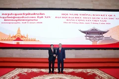 Vietnam, Laos leaders co-chair conference on outcomes of 14th Party Congress
