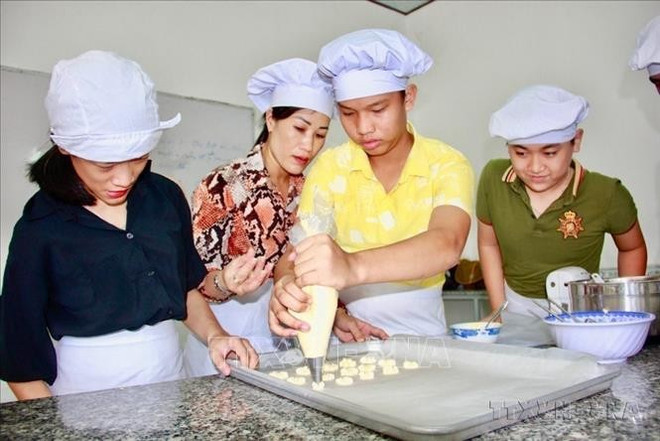 Vocational training for children with disabilities. (Photo: VNA)