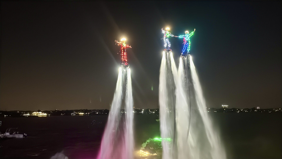 Flyboard athletes perform above the surface of the Dong Nai River. (Photo: VNA)