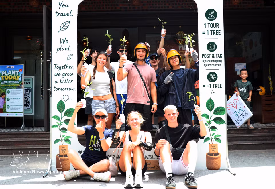 International tourists enjoy planting young trees while exploring the karst plateau. (Photo: VNA)